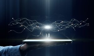 hand-holding-tablet-with-creative-glowing-lamp-on-2025-10-15-03-21-04-utc